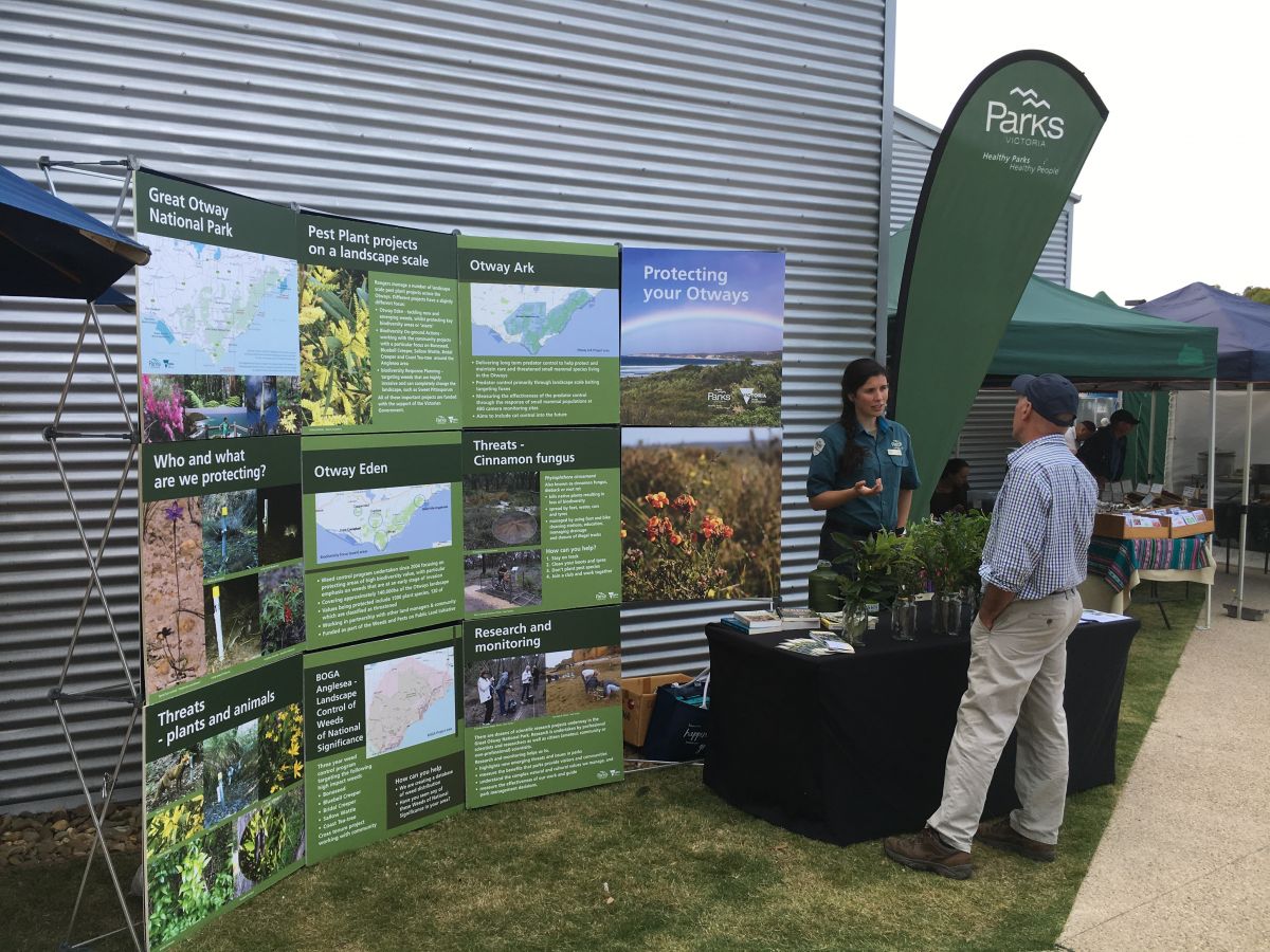 An image of an Otway Eden information stall by Otway Eden. The image contains people and signage.